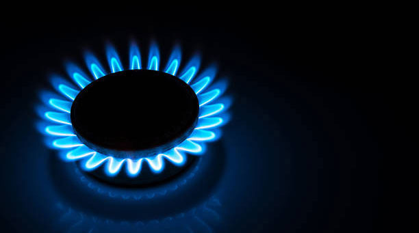 gas stove lit with blue flame